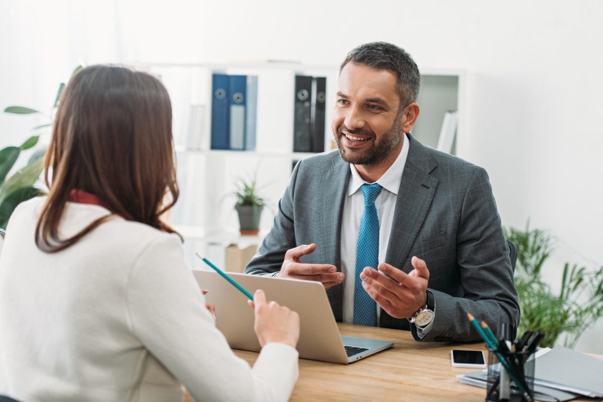 Woman Speaking to Financial Advisor