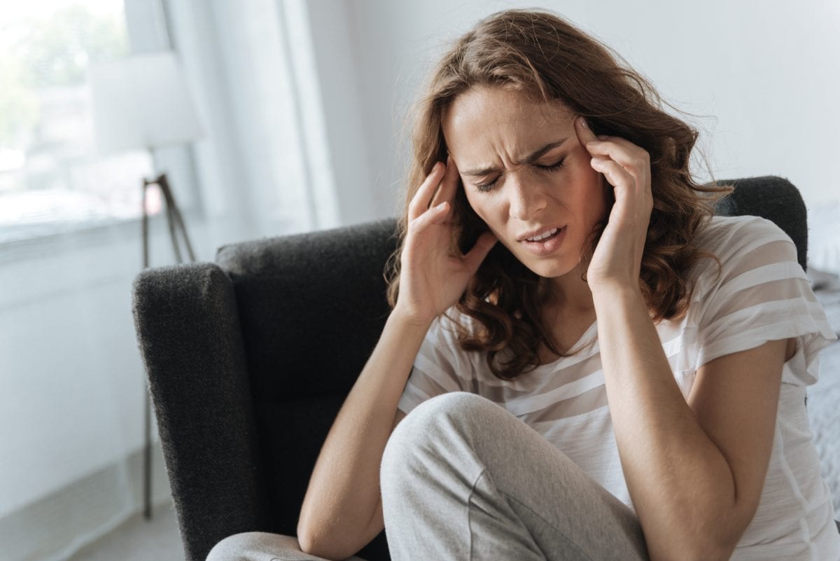 Woman Suffering from Migraine
