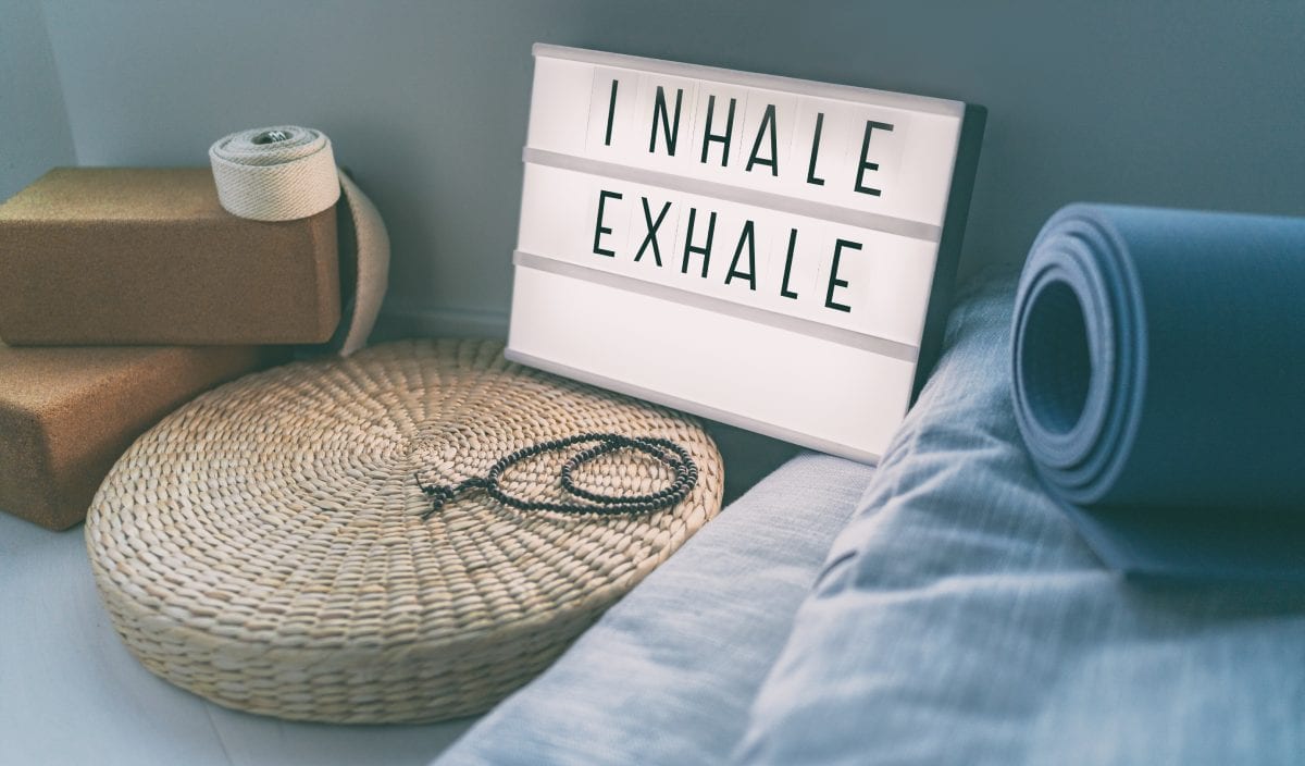 Inhale and Exhale Sign Next to Yoga Mat