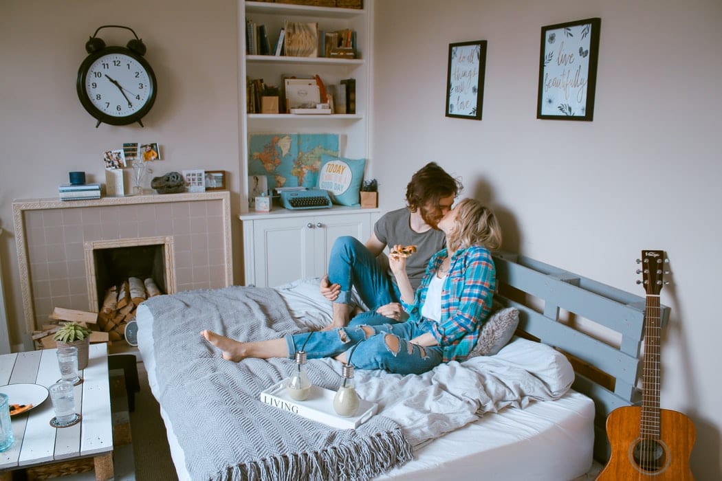 Couple Eating in Bed