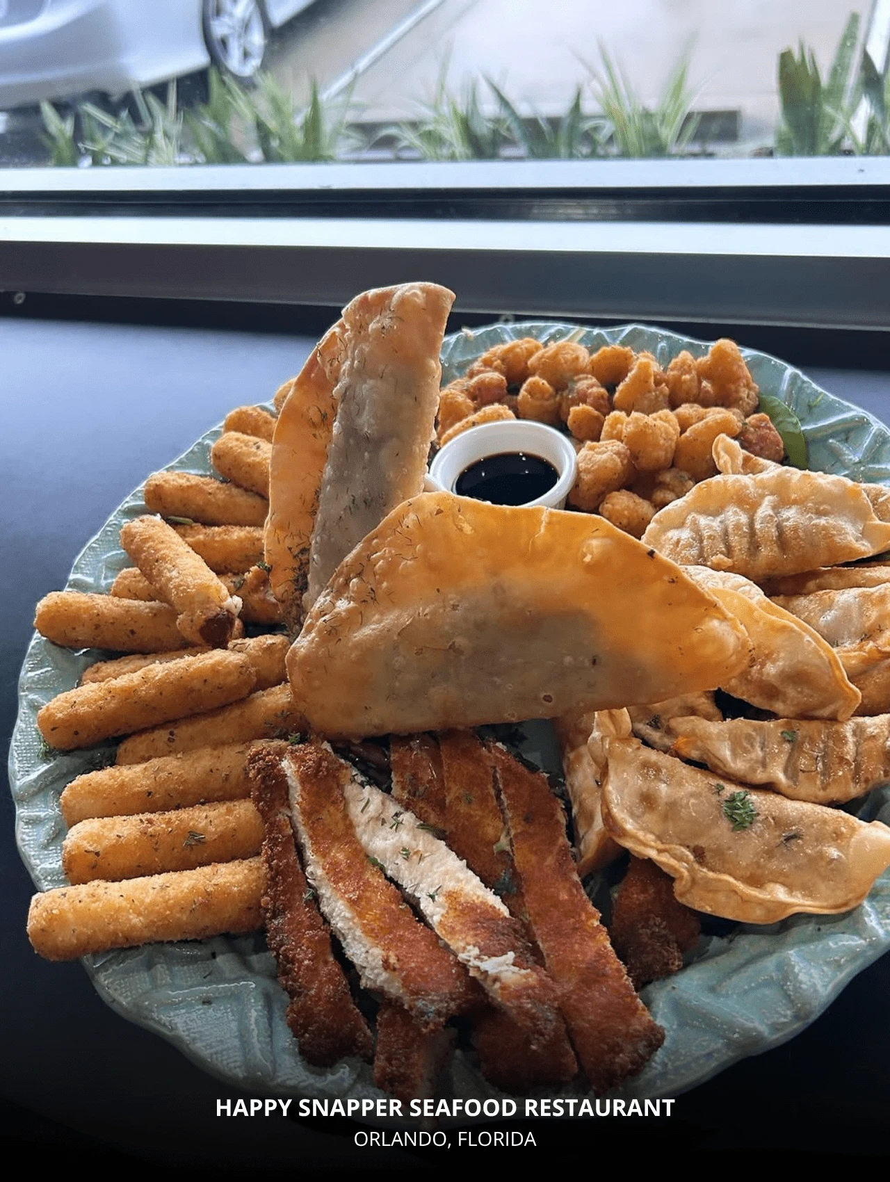 Seafood platter at Happy Snapper Seafood Restaurant – best Orlando restaurants for fried seafood bites.