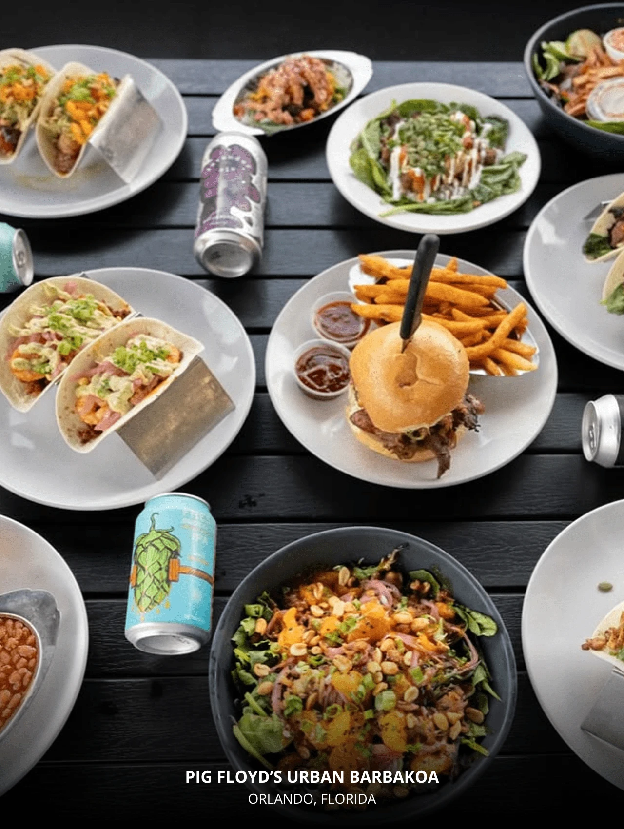Pig Floyd’s Urban Barbakoa table spread with tacos, burger, salad, and sides – best Orlando restaurants.