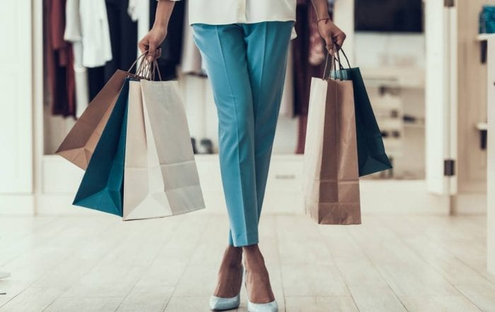 Items for Sale: Woman with Shopping Bags