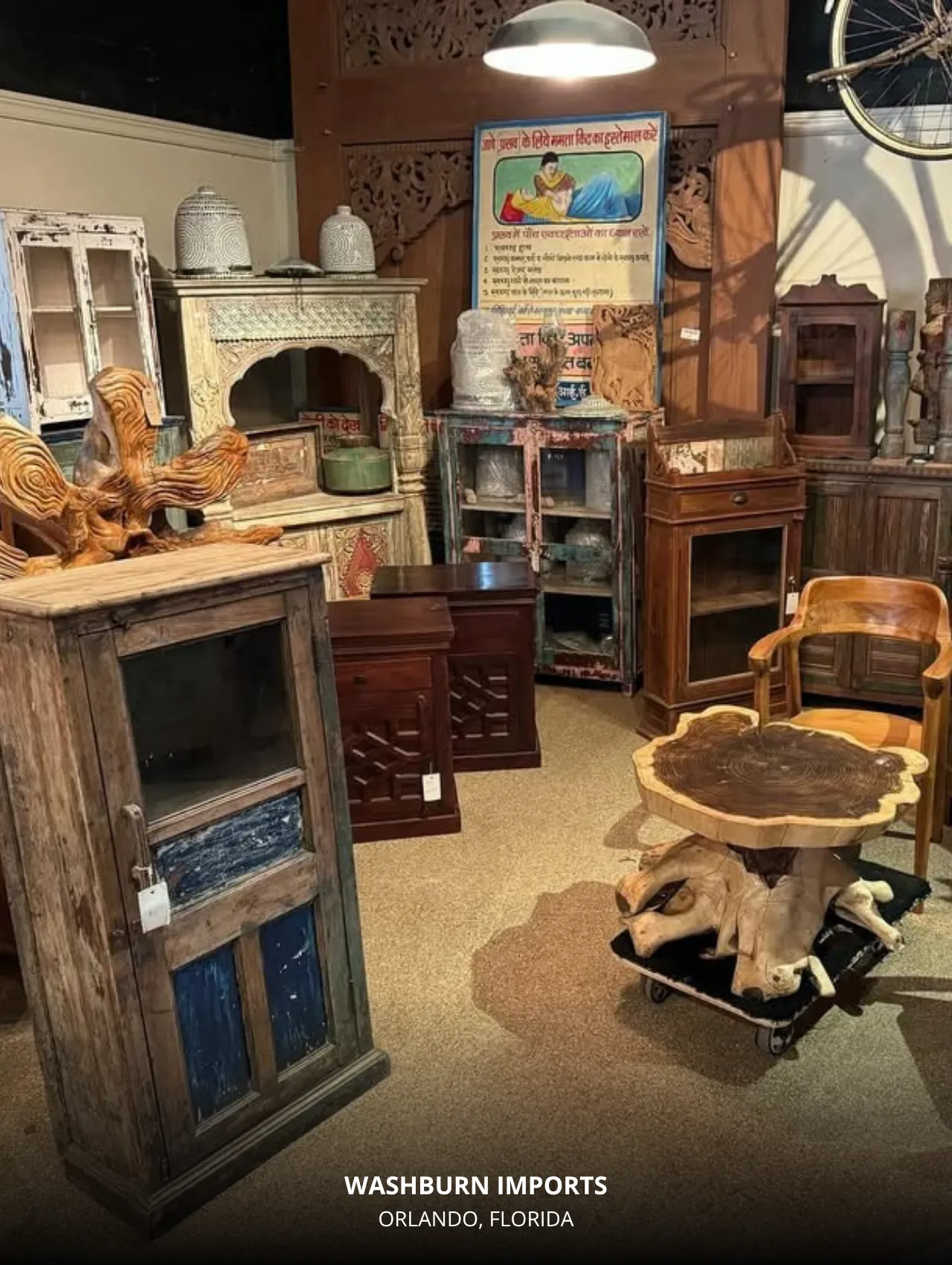 Washburn Imports Orlando Florida showroom with eclectic global-inspired furniture and wall art featuring warm, textured design elements.