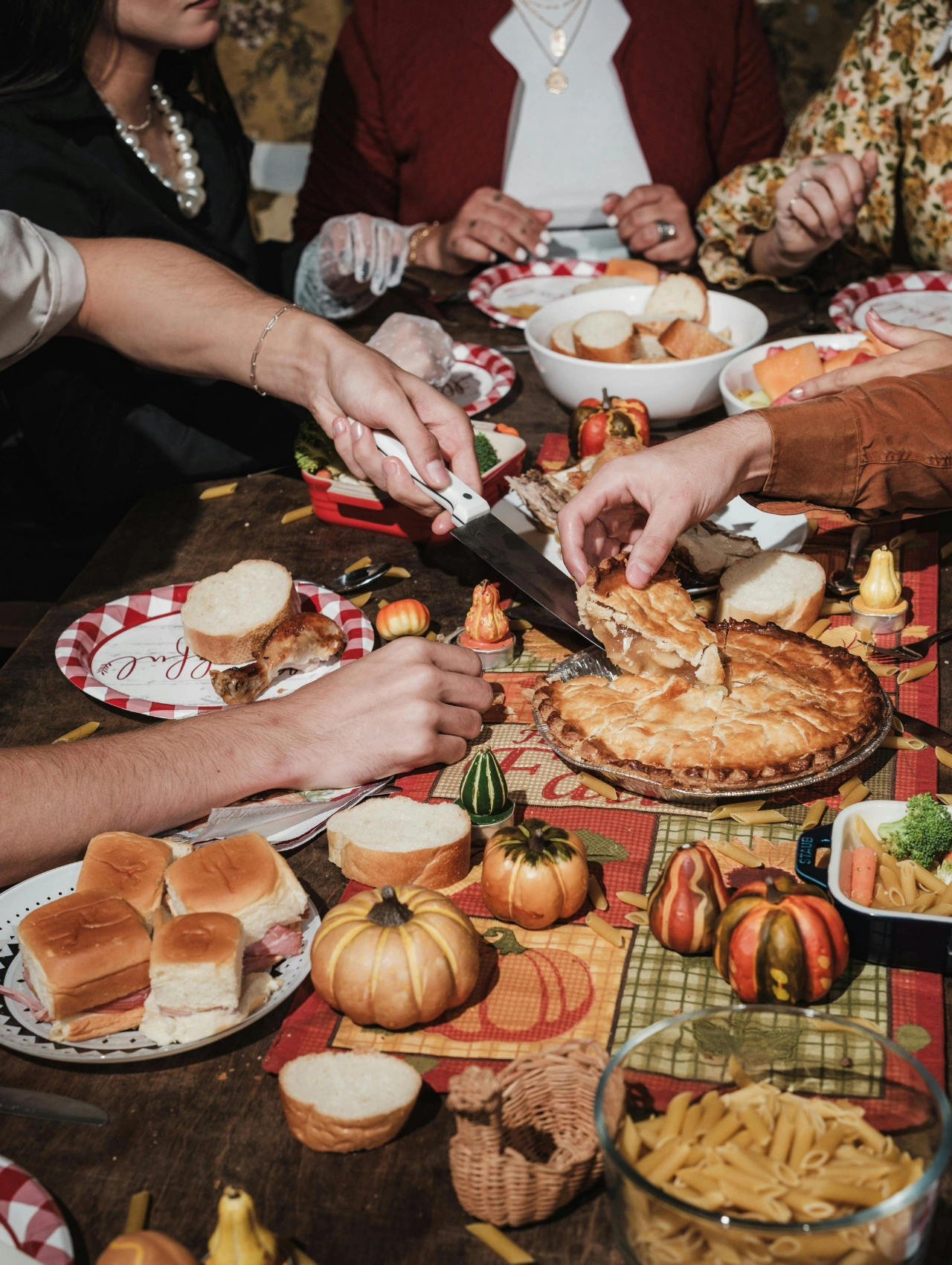 Friends laughing and dining together — the ultimate Thanksgiving Party Ideas inspiration.
