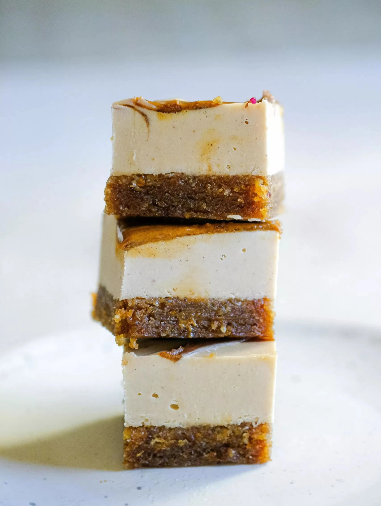 Stack of no bake mini Biscoff cheesecakes served as a sweet Christmas Dinner dessert.