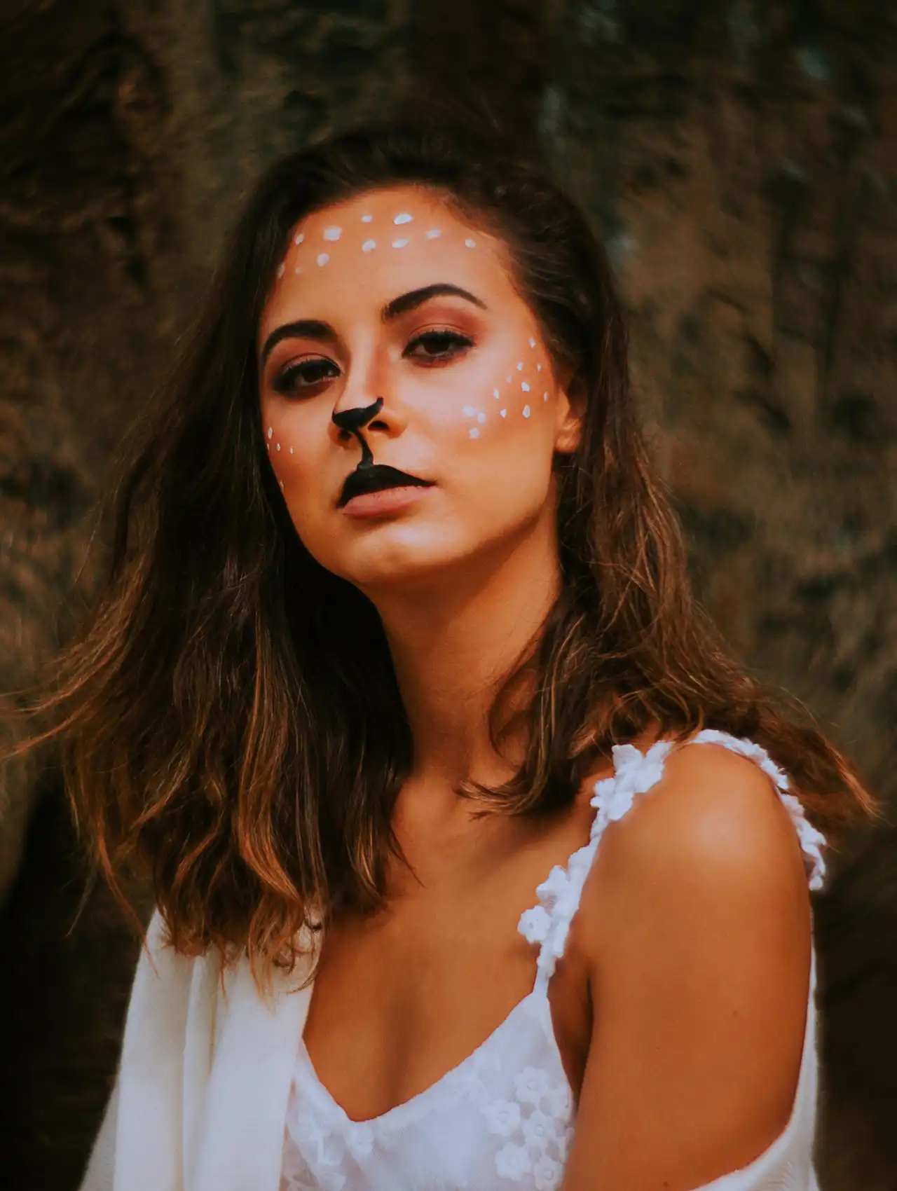 Deer-inspired halloween makeup looks with white spots, dark nose, and soft natural tones.