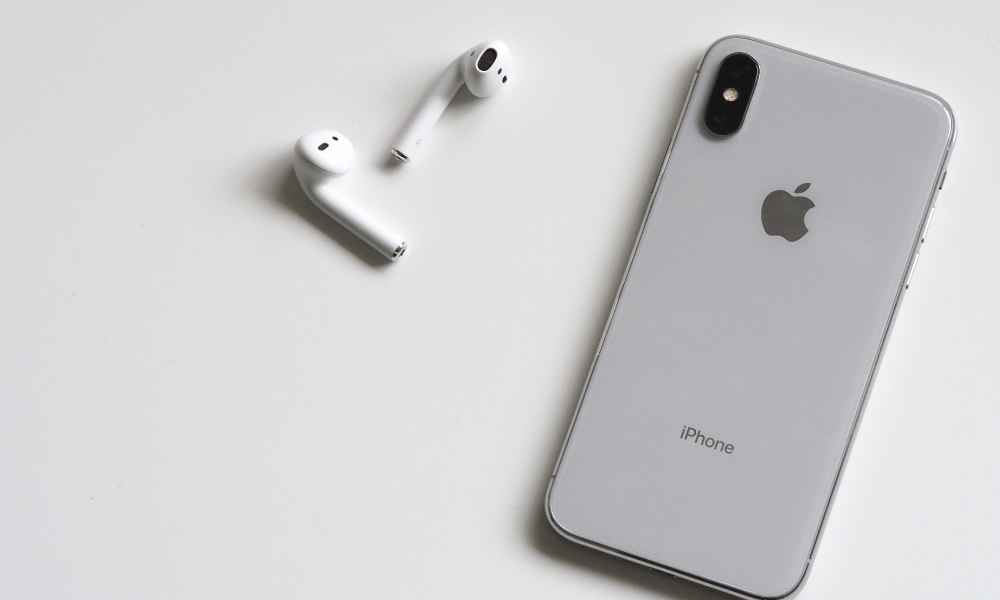 airpods next to an iphone
