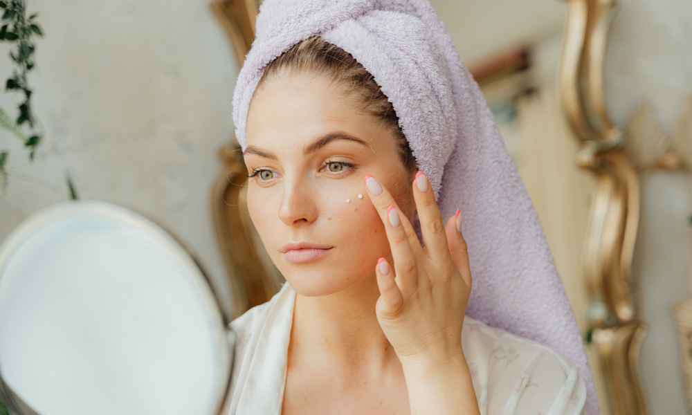 Woman applying primer.