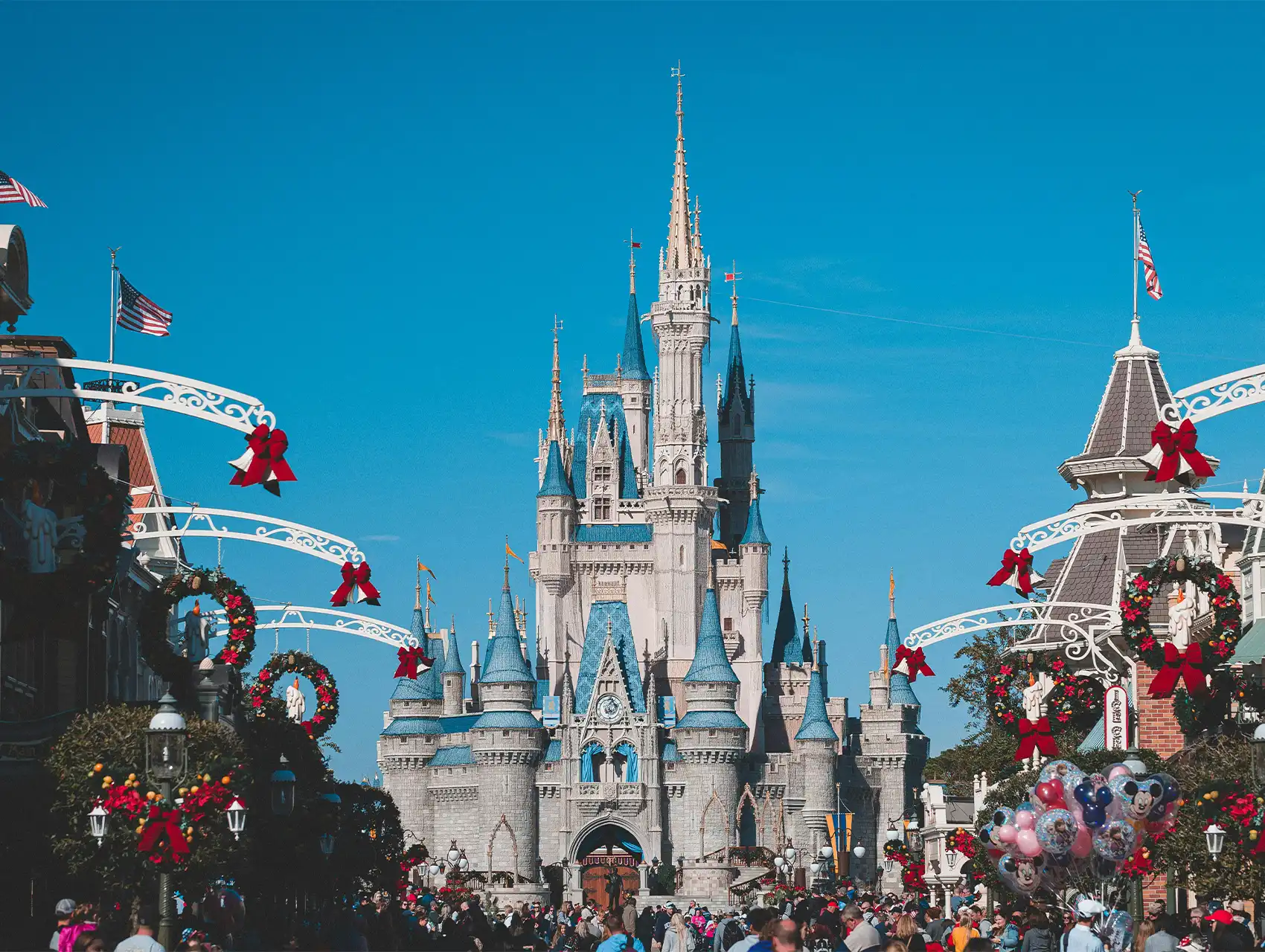 Cinderella Castle at Walt Disney World decorated for the holidays, a must-see attraction for families moving to Orlando