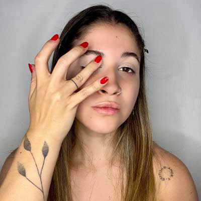 Woman applying eye primer.