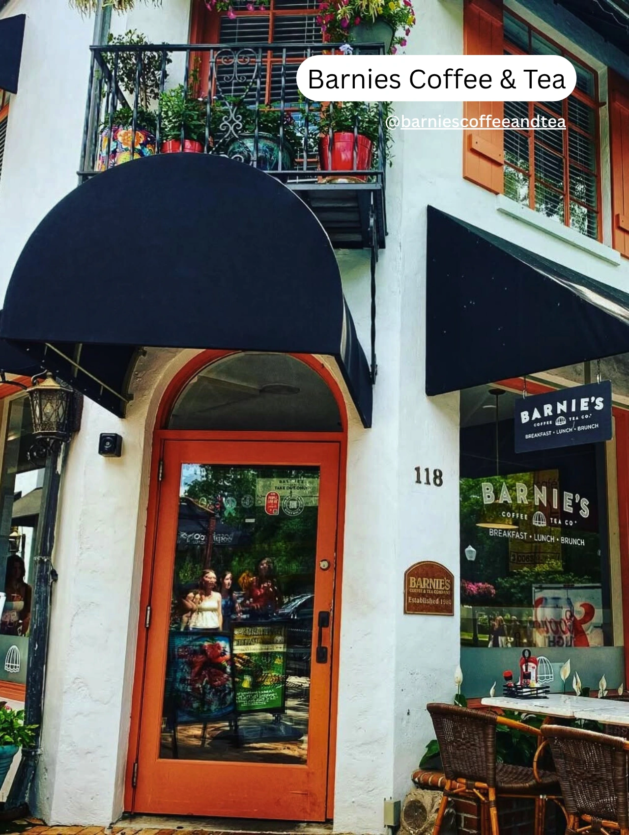 Exterior of Barnies Coffee & Tea with patio tables and colorful balcony plants on of the best coffee shoops in orlando