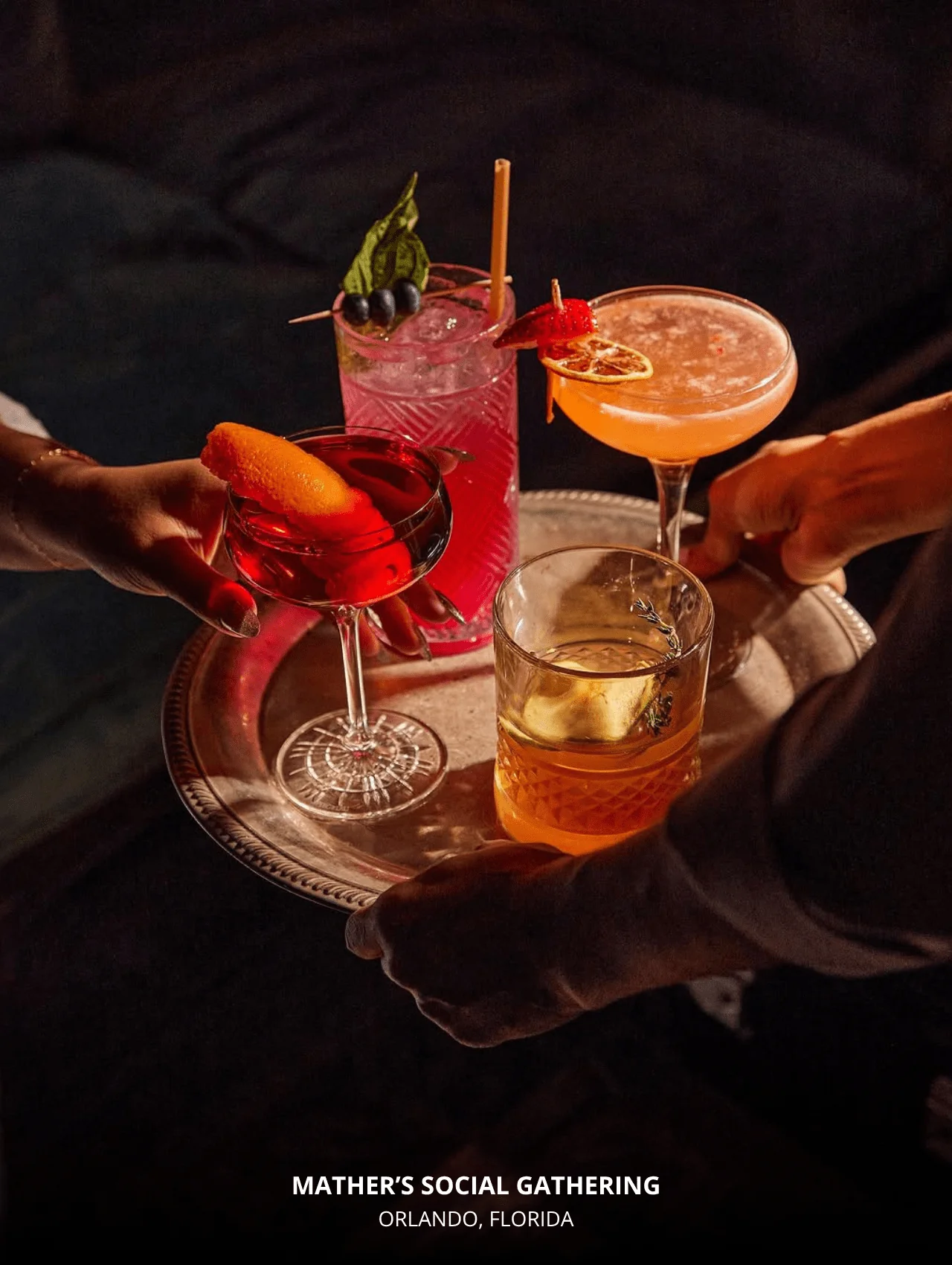 A tray of colorful, elegant cocktails at Mather’s Social Gathering — featured in restaurants with great cocktails in Orlando.