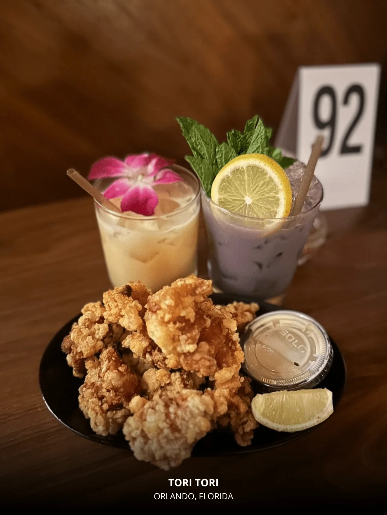 Colorful cocktails and fried chicken dish at Tori Tori — featured in restaurants with great cocktails in Orlando.
