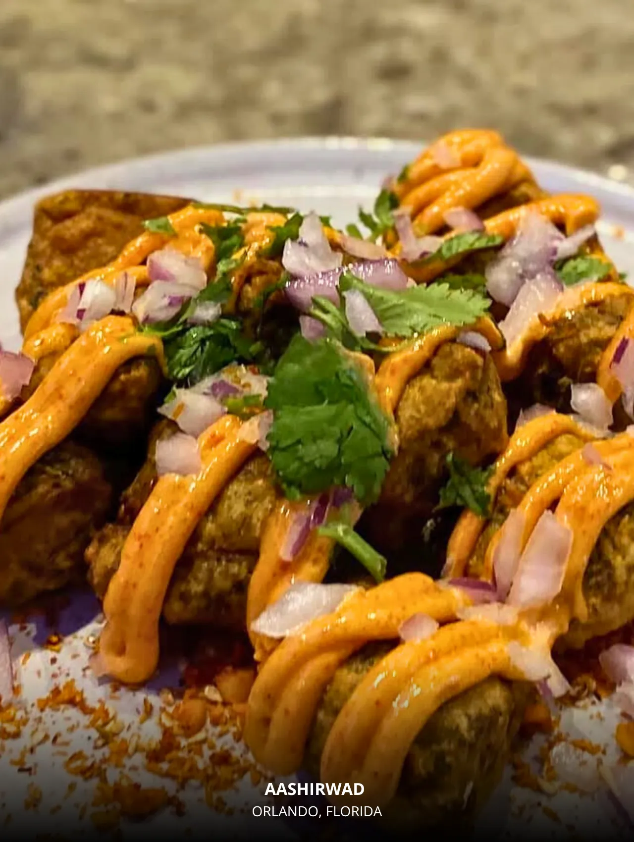 Aashirwad small-plate chaat drizzled with spicy sauce – best restaurants in Orlando Indian fine dining.