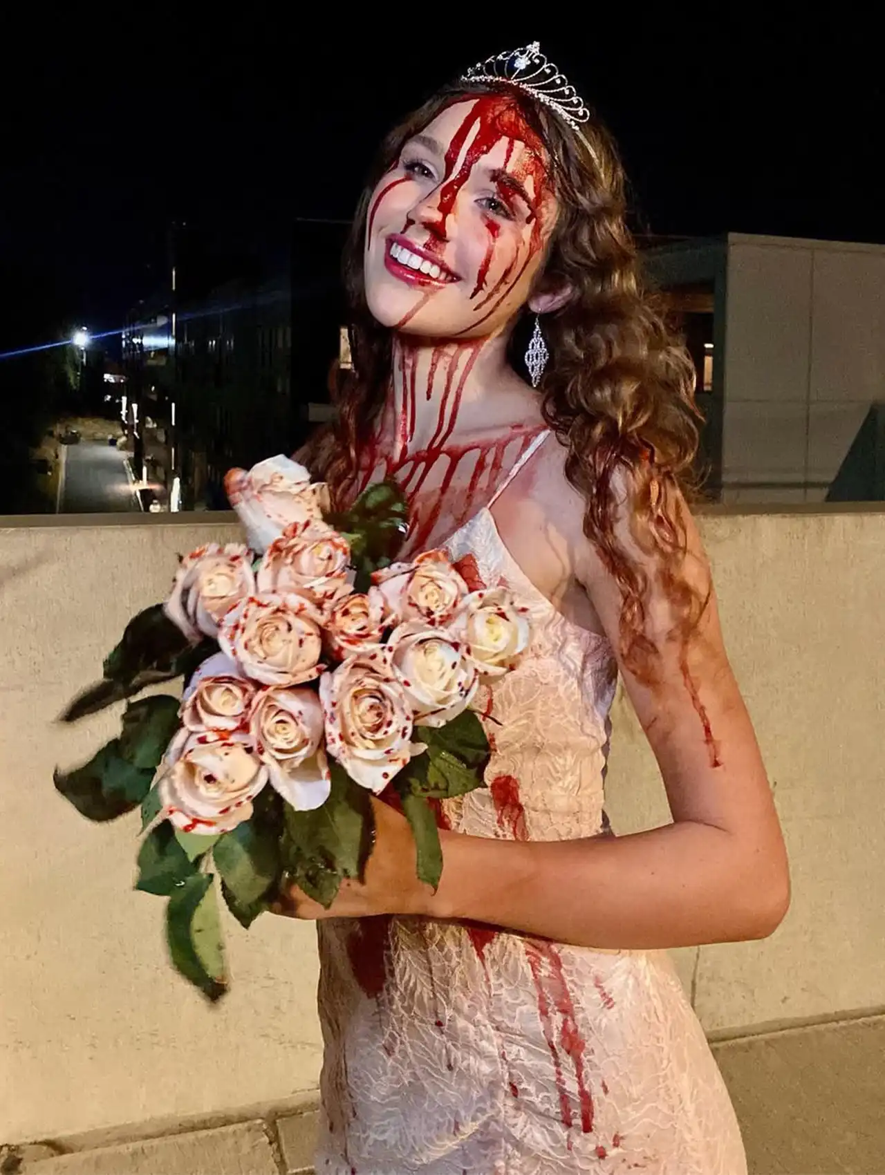 Carrie inspired prom queen look with fake blood and roses, most popular halloween costumes