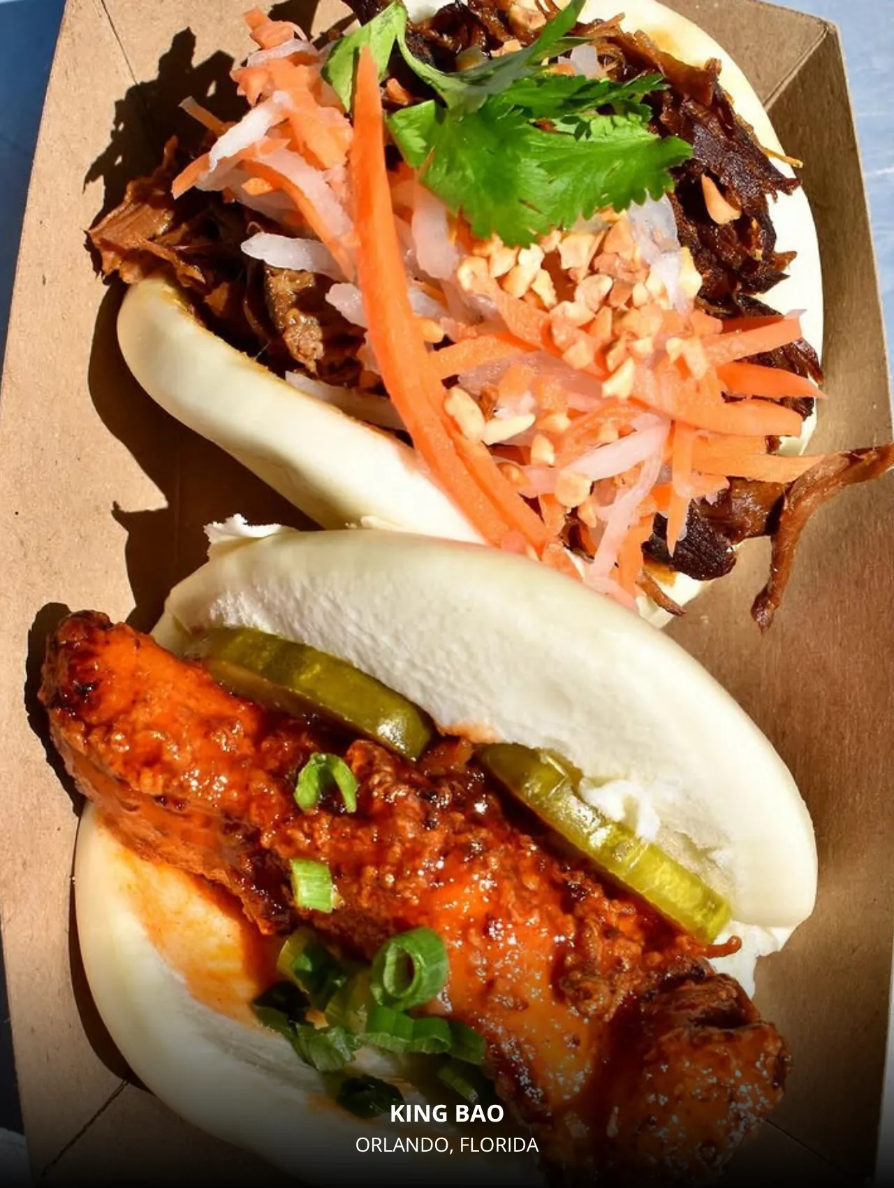 Bao buns with spicy chicken and pickles at King Bao – best restaurants in Orlando for quick eats.