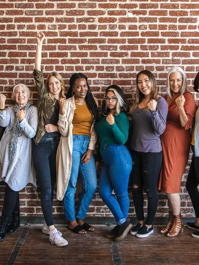 a group of women posing for a photo