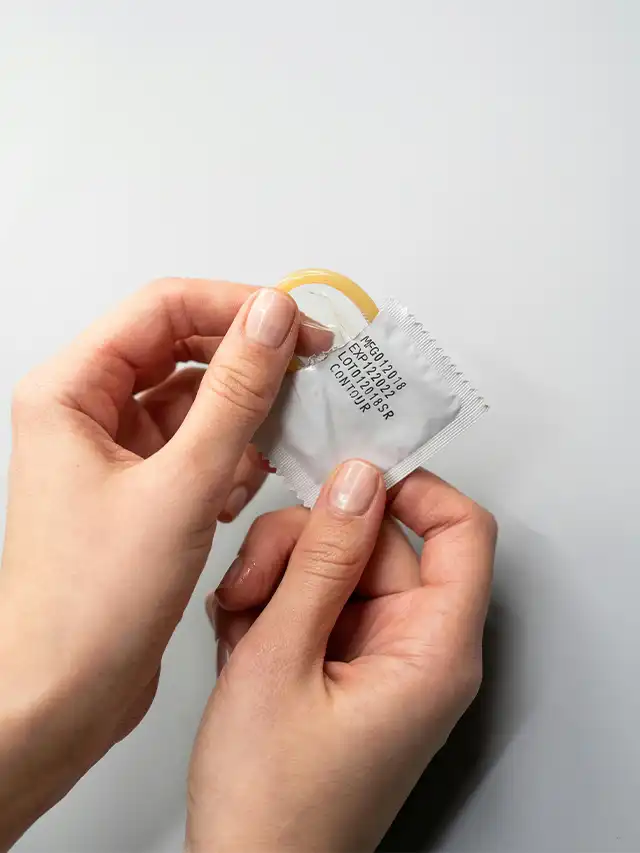 a person holding a condom