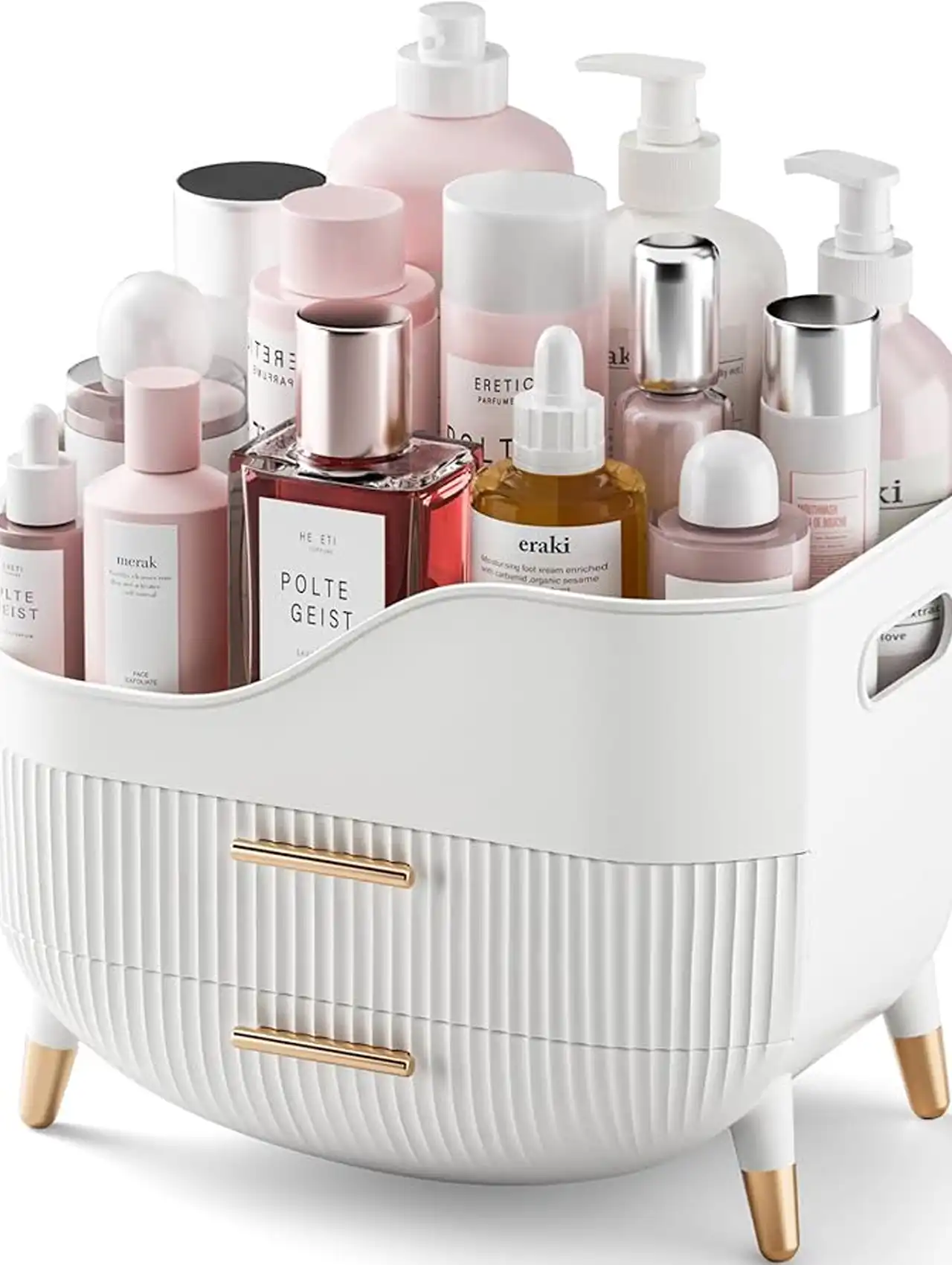 Organizador blanco con cajones dorados para cosméticos sobre tocador de maquillaje.