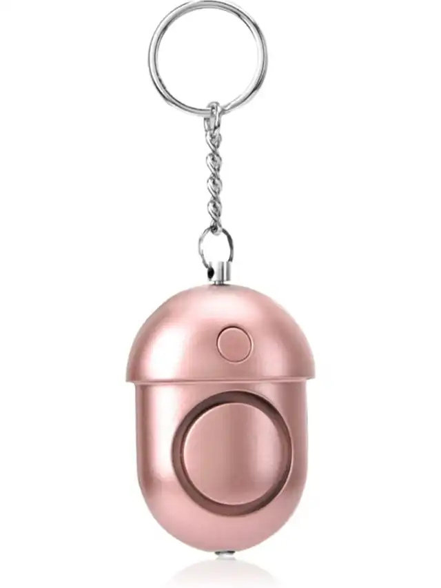 a pink key chain with a round object