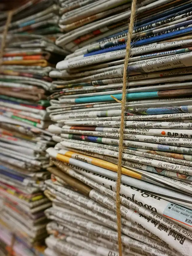 a stack of newspapers tied together