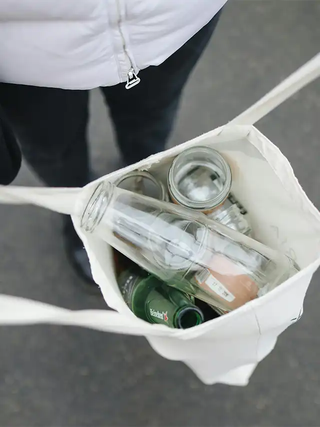 a bag full of glass bottles