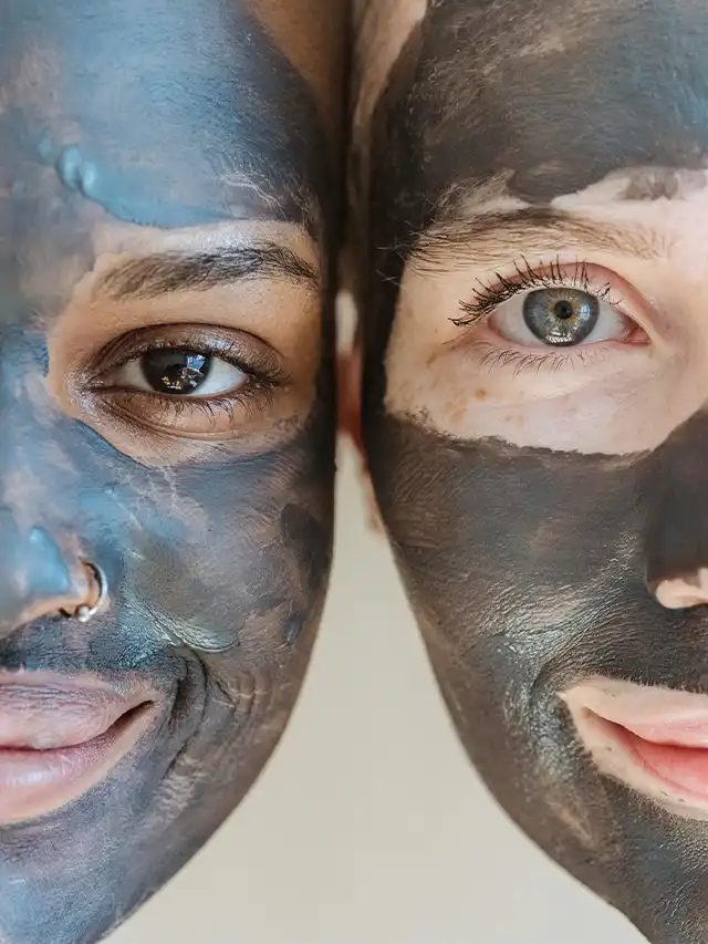 two people with black face masks