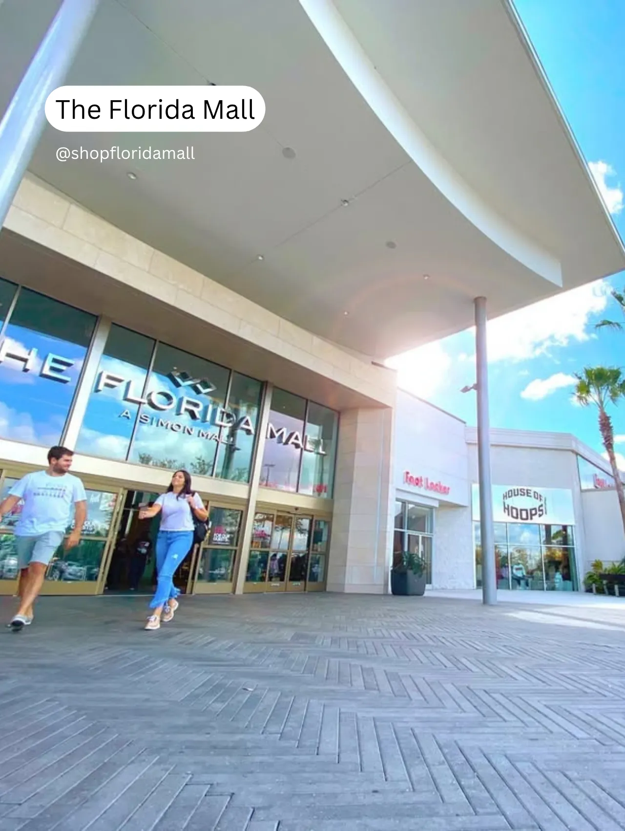 Couple walking out of The Florida Mall on a sunny day, a great example of things to do in Orlando besides the theme parks.
