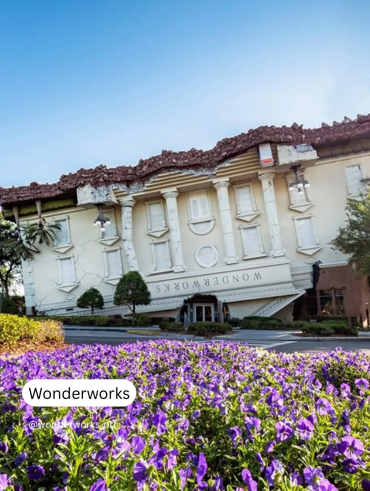 WonderWorks Orlando with upside-down architecture and purple flowers in the foreground – a unique pick for things to do in Orlando besides the theme parks.