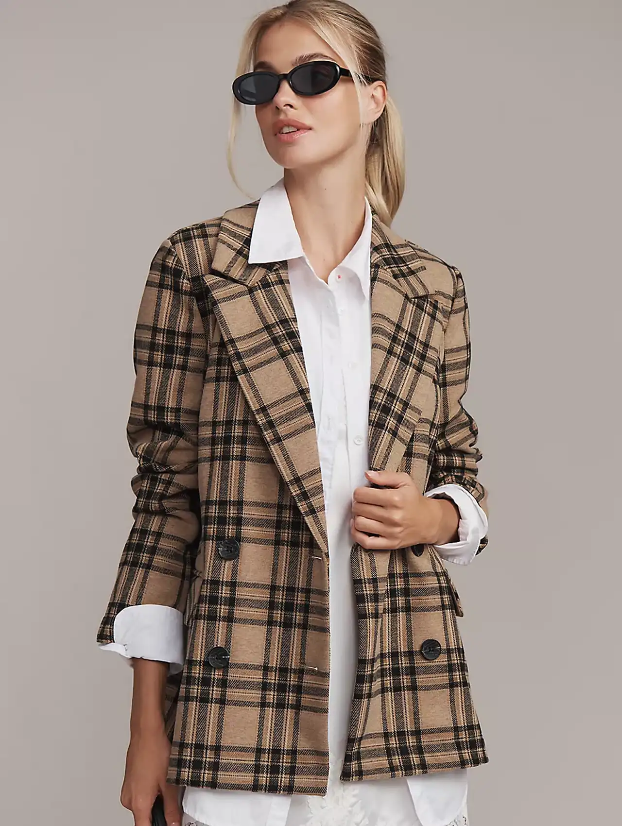 Woman wearing plaid double-breasted blazer with white shirt and sunglasses, fall clothing for women