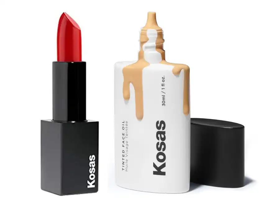 a white container with liquid on top next to a red lipstick