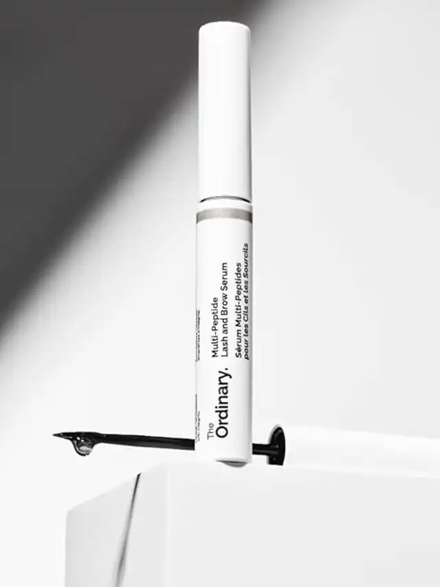 a white tube with a white cap on top of a white box
