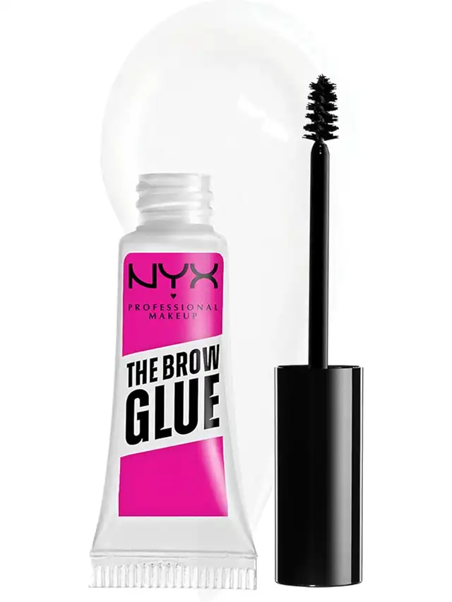 a tube of eyelash glue next to a black mascara brush