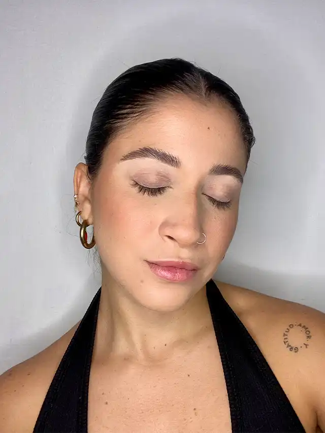 a woman with her eyes closed
