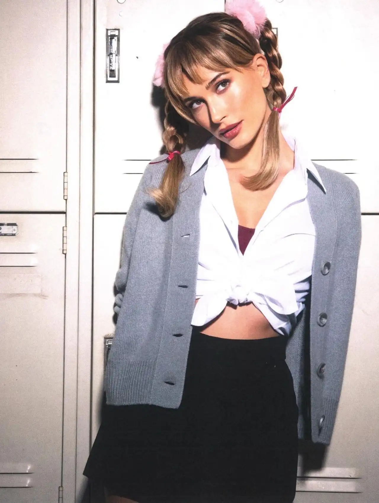 Hailey Bieber dressed as Britney Spears in a schoolgirl look for celebrity Halloween costumes.