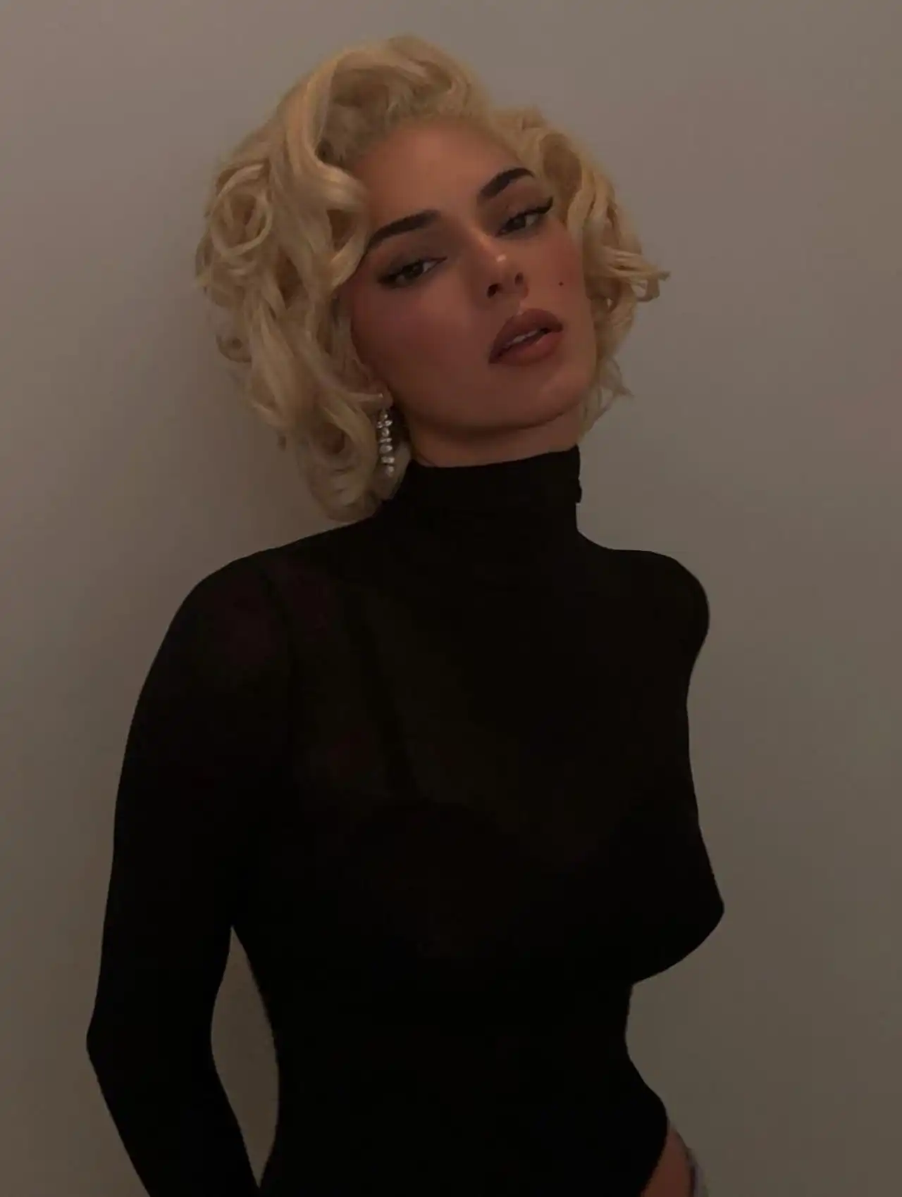 Kendall Jenner dressed as Marilyn Monroe in a glamorous look for celebrity Halloween costumes.