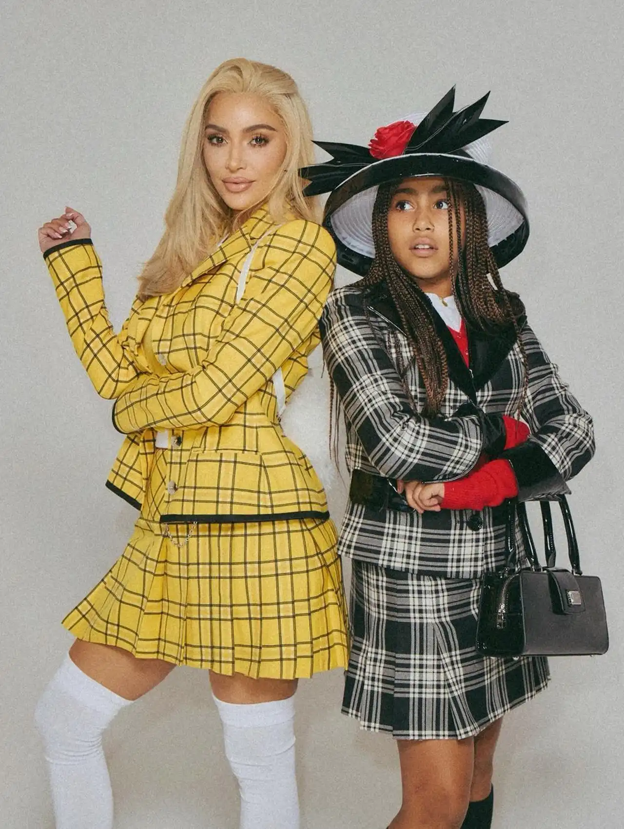 Kim Kardashian and North West dressed as Cher and Dionne from Clueless for celebrity Halloween costumes.