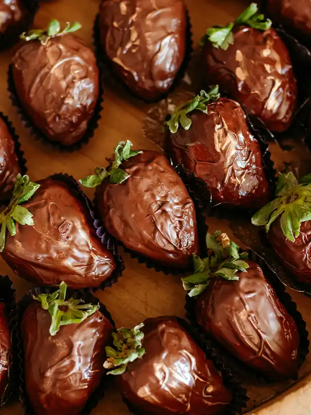 chocolate covered strawberries with green leaves