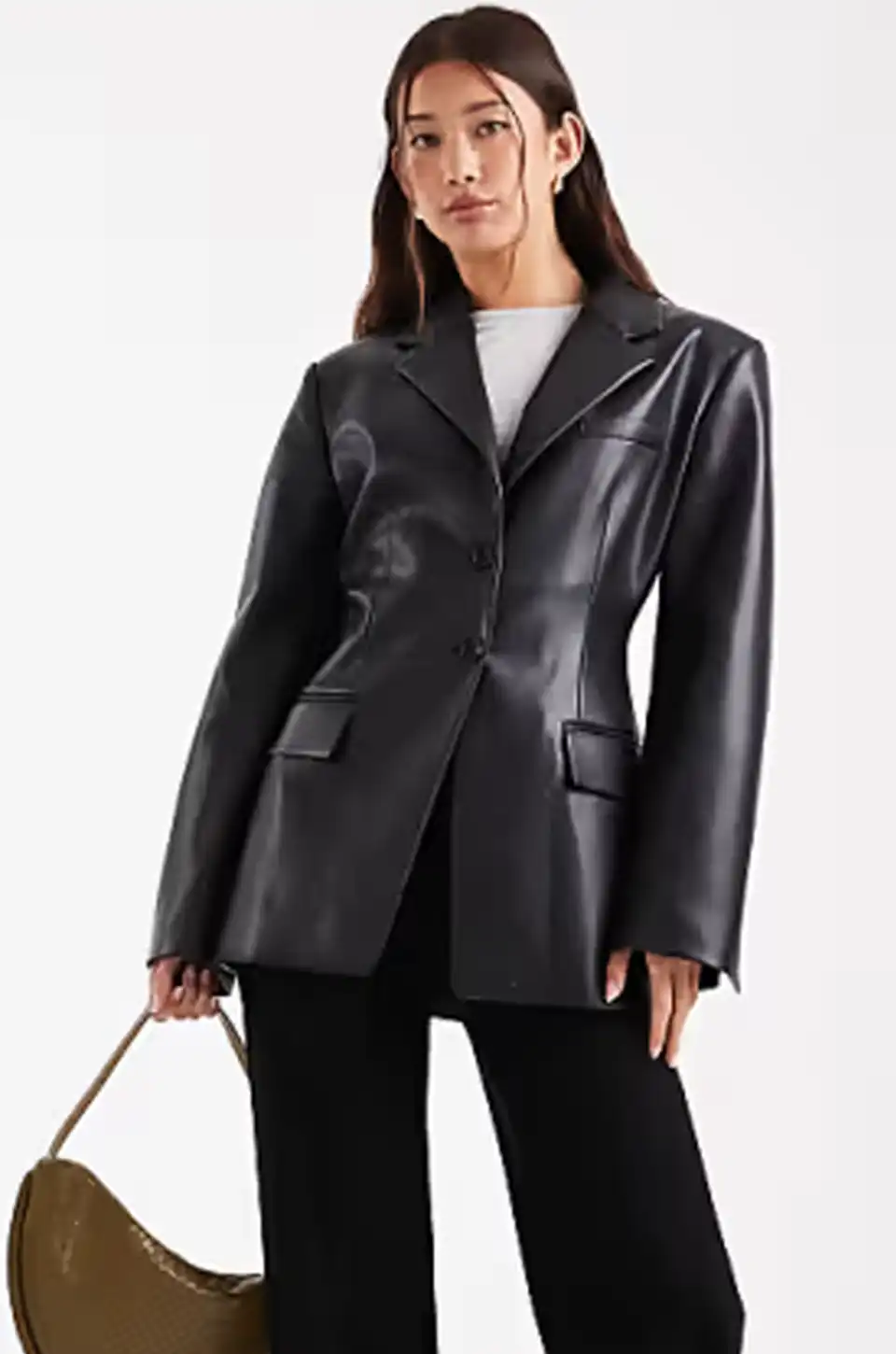 Woman modeling a tailored black leather blazer with a cinched waist design