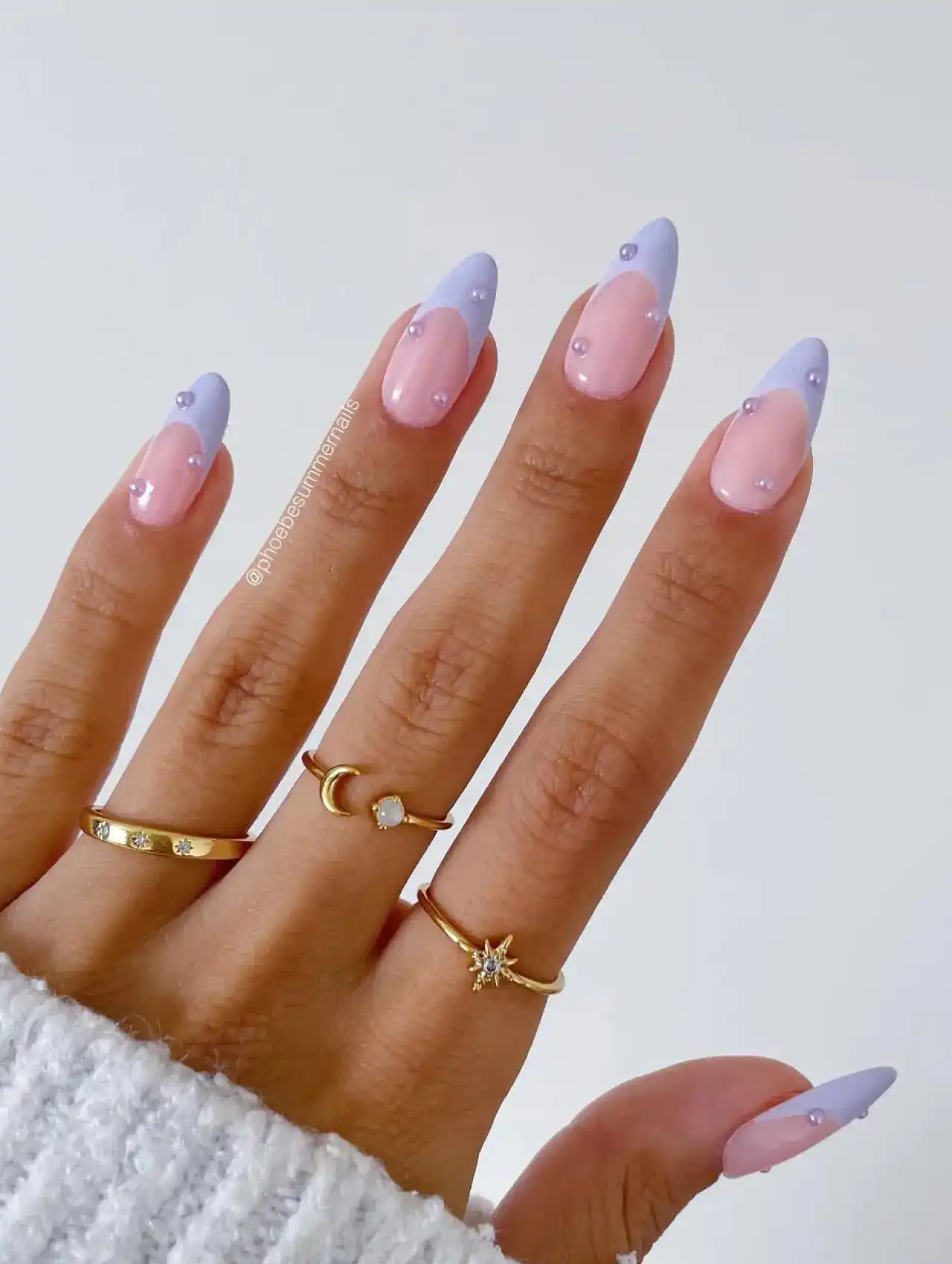 Pink nails with lavender diagonal French tips and rhinestone accents, nail art design 2025.