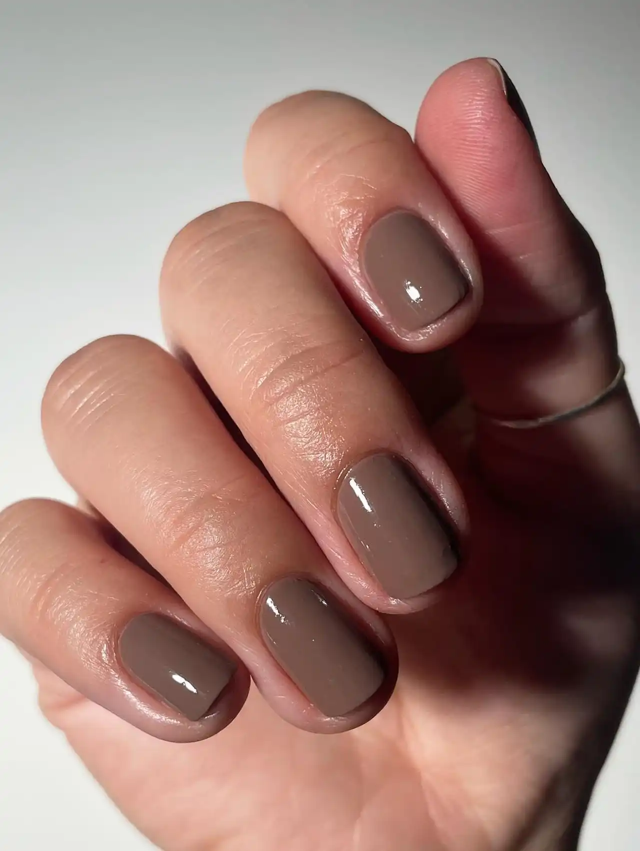 Short nails with glossy mocha mousse polish, part of nail art design 2025.