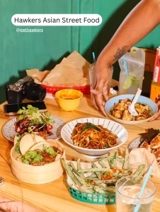 Shared dishes at Hawkers Asian Street Food, a pet friendly restaurant in Mills 50 Orlando.