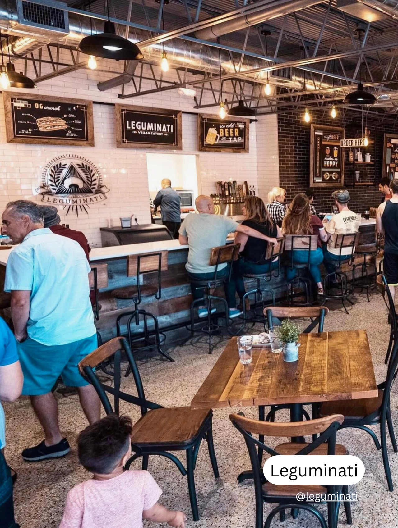Interior view of Leguminati vegan eatery in Orlando with casual seating and friendly atmosphere.