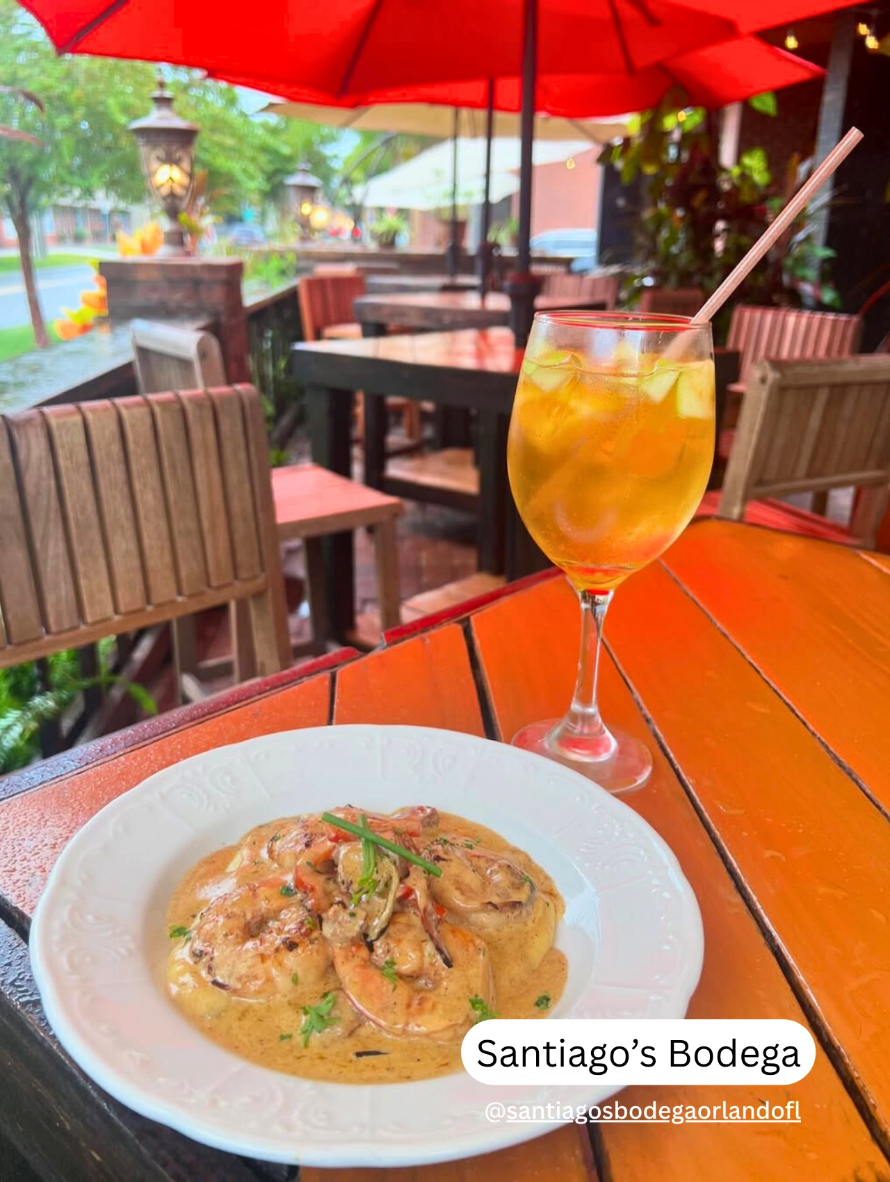 Outdoor patio with tapas and drinks at Santiago’s Bodega, a cozy pet friendly restaurant in Orlando.