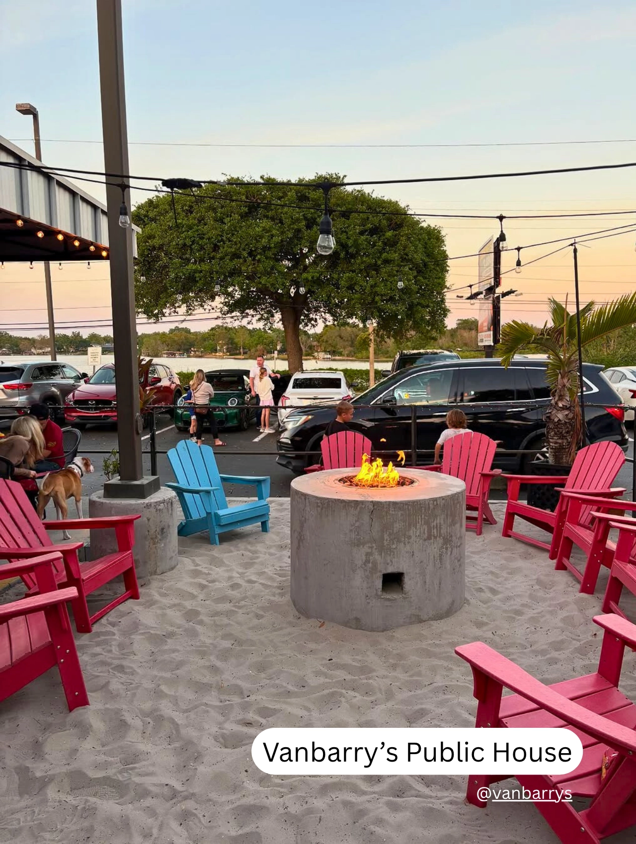 Fire pit and colorful Adirondack chairs at Vanbarry’s Public House, a beachy pet friendly bar in Orlando.