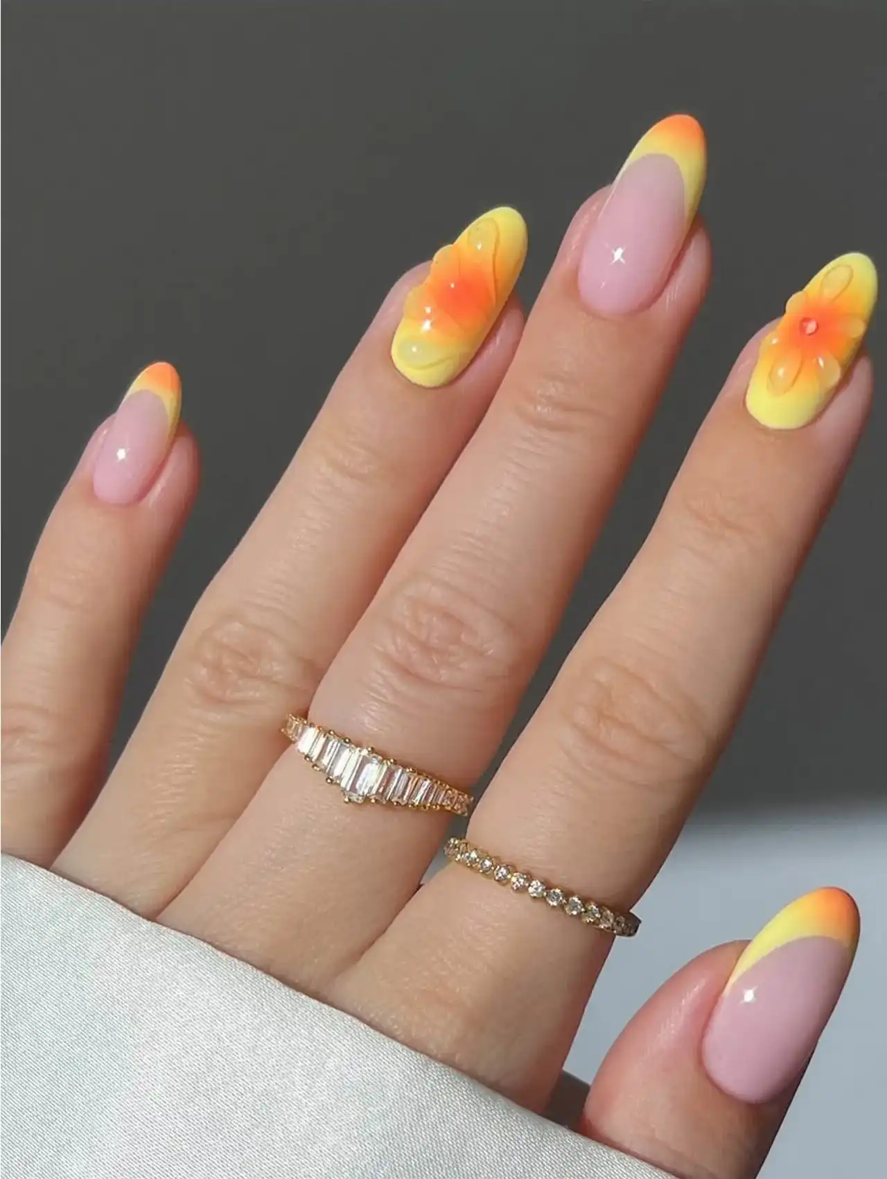 Neon nails with yellow and orange floral-inspired design