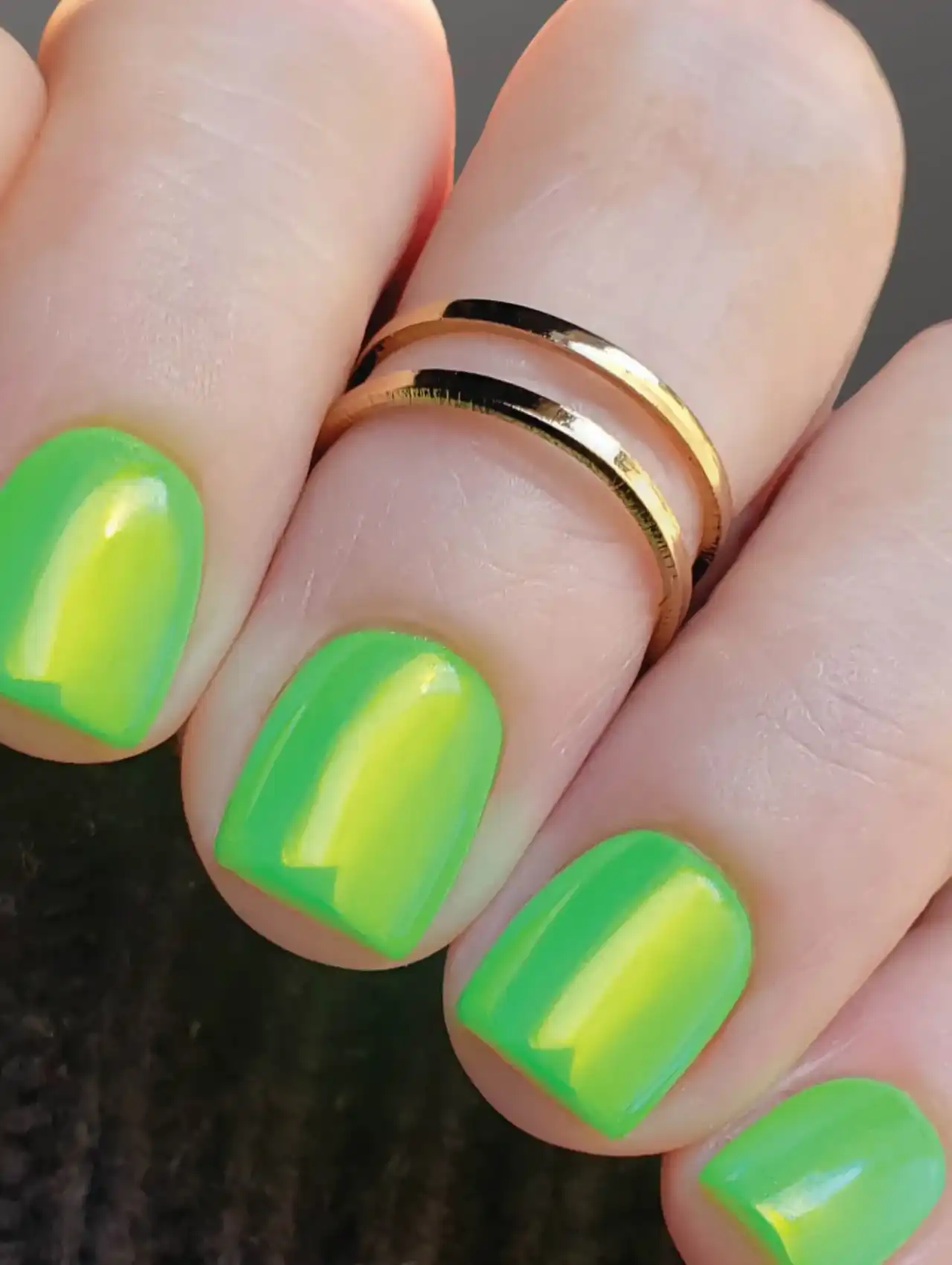 Solid lime green neon nails with a glossy finish