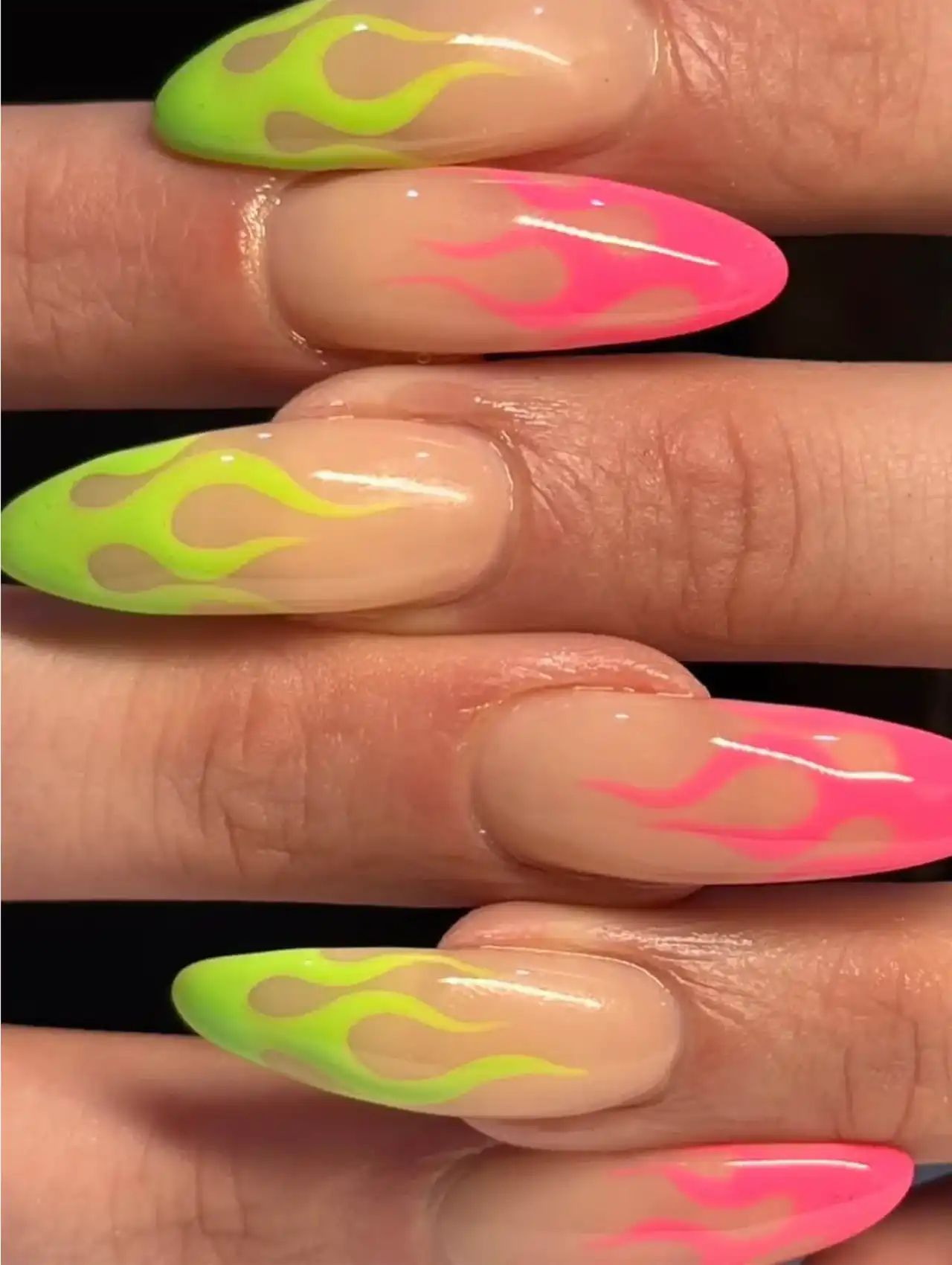 Neon nails with pink and green flame art over nude base