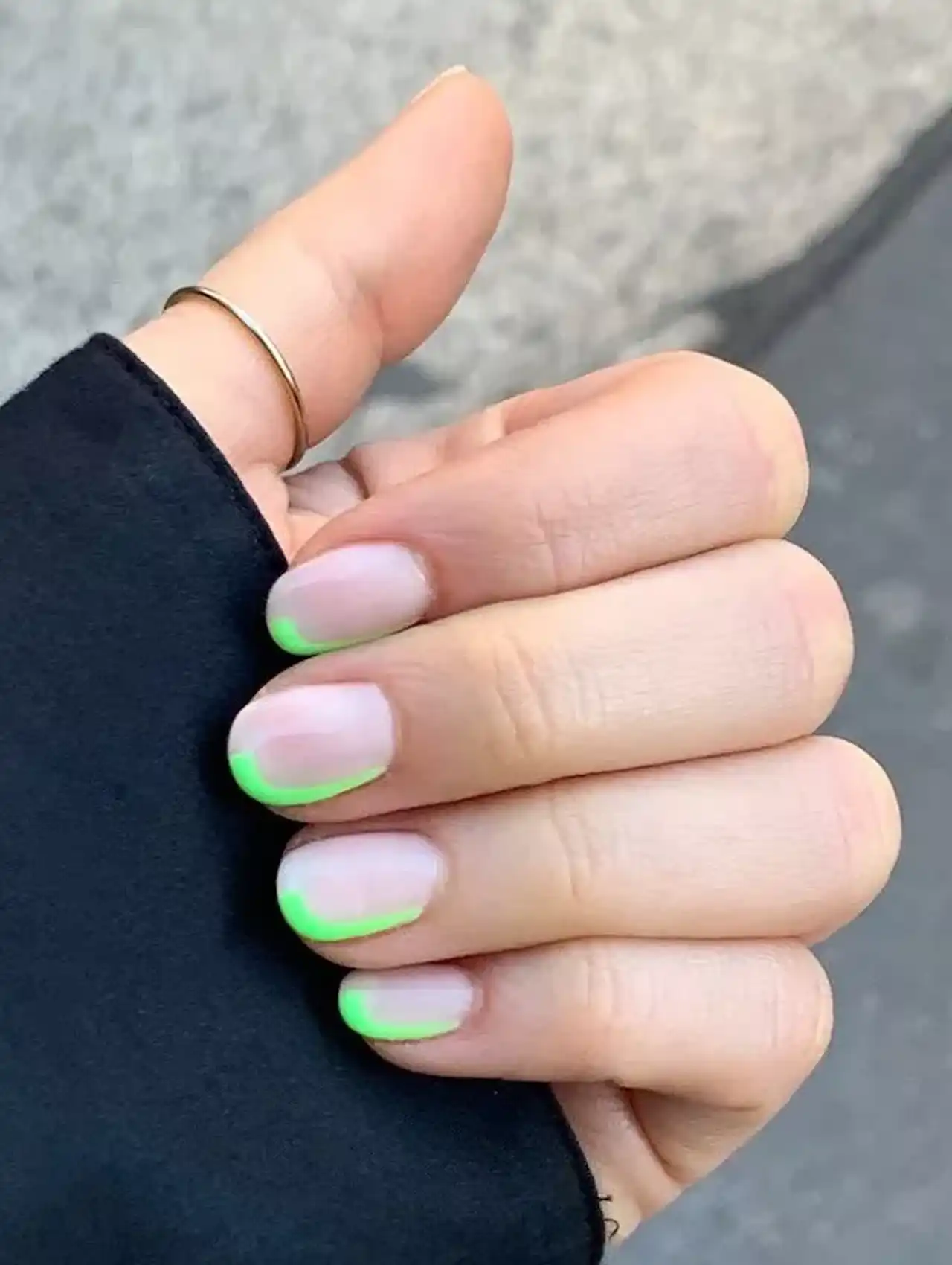 Nude nails with neon green French tips
